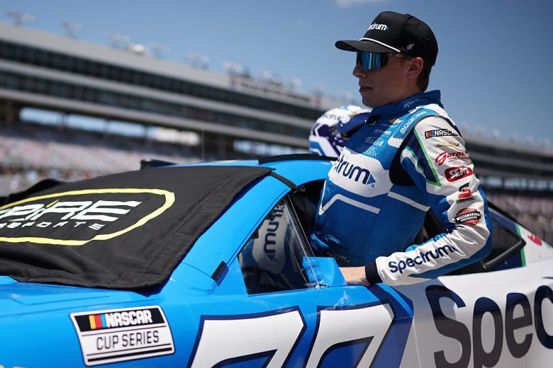 Carson Hocevar enters his car.