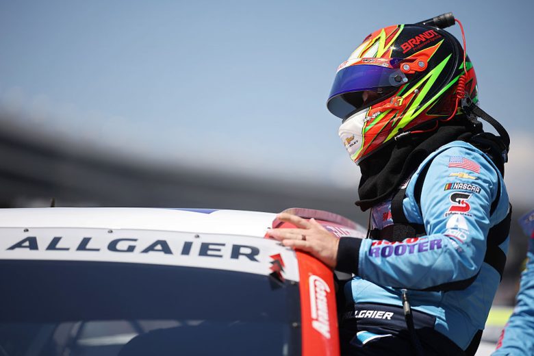 Justin Allgaier enters his car.