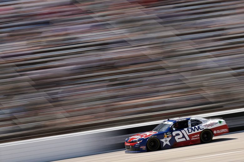 Austin Hill drives at Texas.