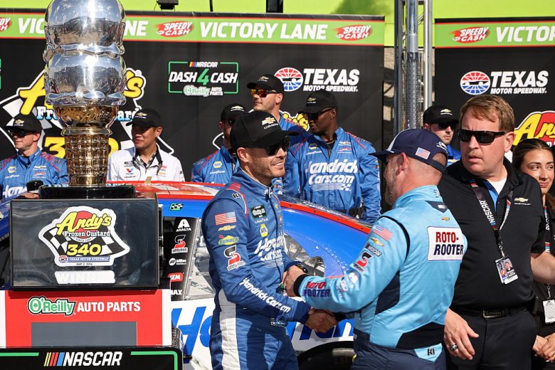 Kyle Larson and Justin Allgaier shake hands.