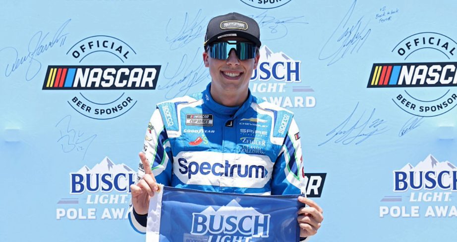 Carson Hocevar celebrates after winning the pole at Texas.