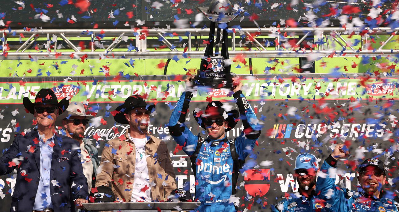 Chase Elliott hoists the trophy in Victory Lane following his NASCAR Cup Series win at Texas Motor Speedway.