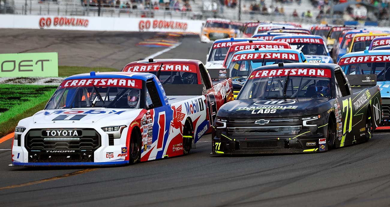 Brent Crews' No. 1 Toyota races alongside the No. 71 Chevy of Connor Zilisch after a restart at Watkins Glen International