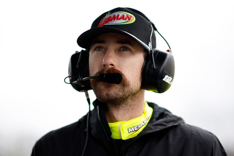 Ryan Blaney looks on.