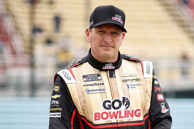 Michael McDowell looks on.