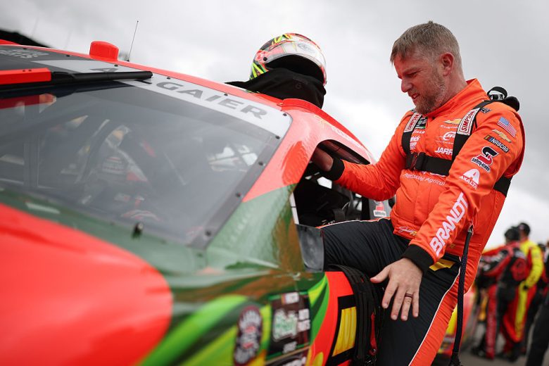 Justin Allgaier enters his car.