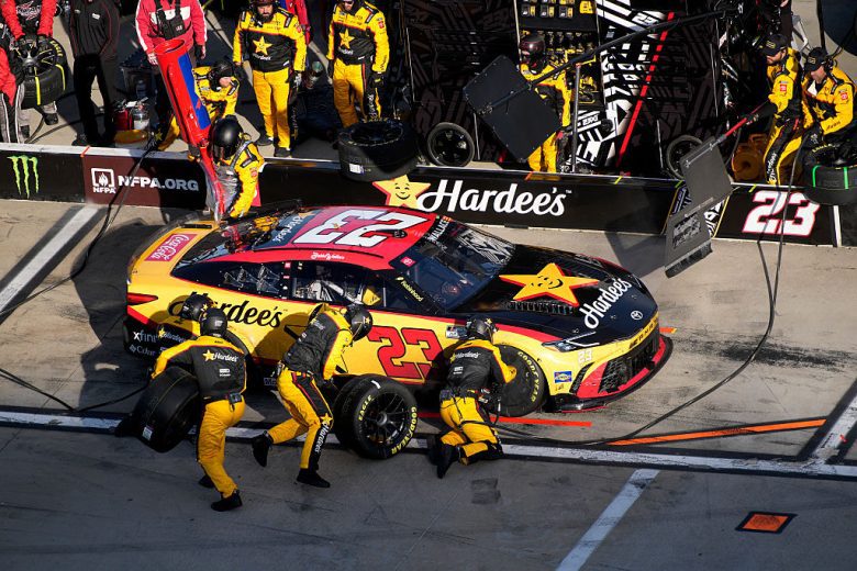 Bubba Wallace's No. 23 23XI Racing Toyota gets tended to on pit road.