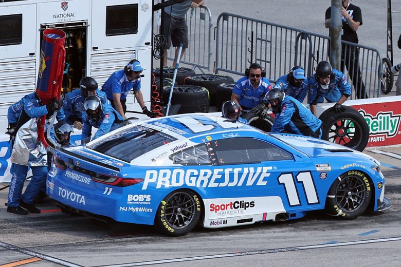 Denny Hamlin's No. 11 Joe Gibbs Racing gets tended to on pit road.