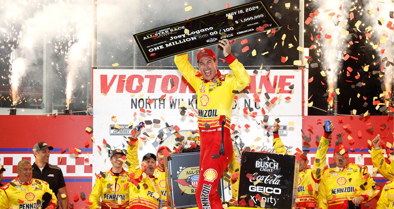 Joey Logano celebrates in Victory Lane following his 2024 All-Star Race win at North Wilkesboro Speedway.