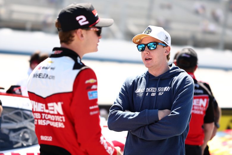Connor Zilisch (R) speaks to Jesse Love on the grid during qualifying.