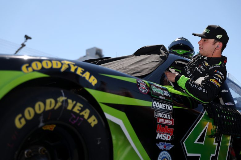 Sam Mayer, driver of the #41 Audibel Chevrolet, enters his car during qualifying