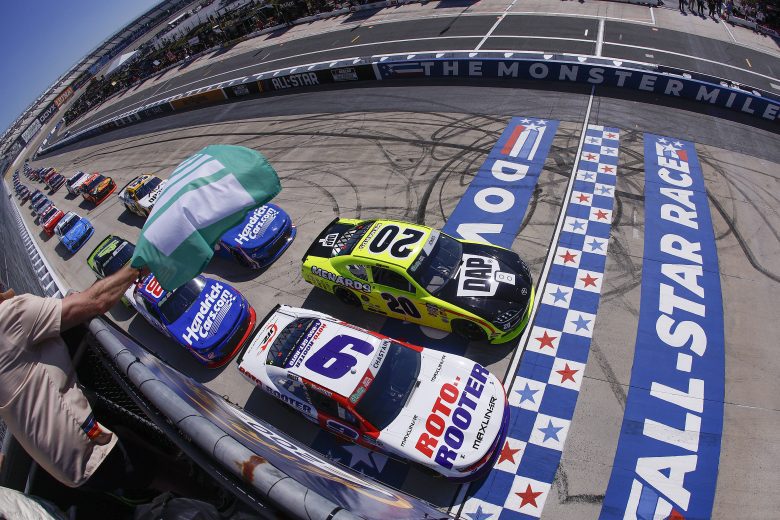 Cars get ready to race at Dover as the green flag drops.