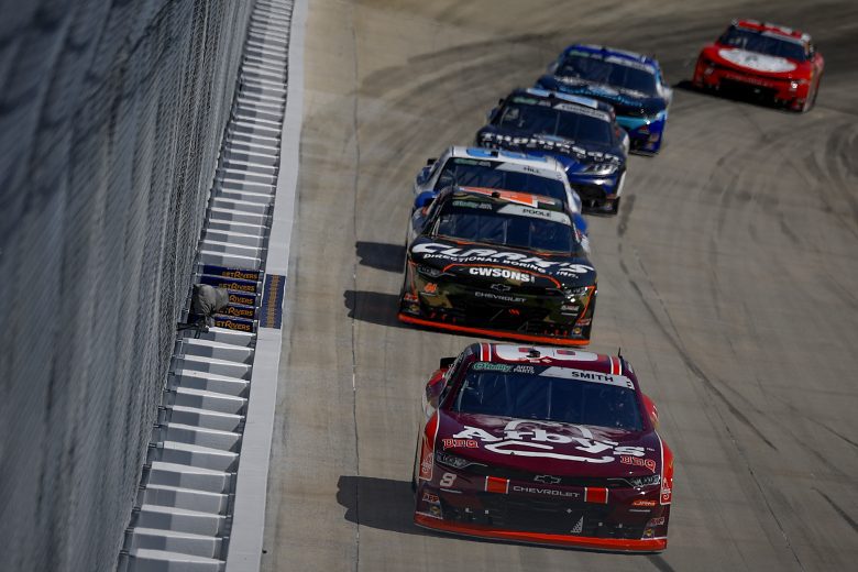 Sammy Smith leads a pack of cars.