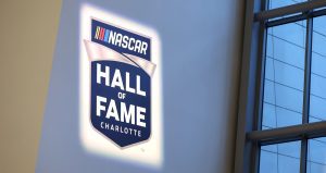 NASCAR Hall of Fame logo is projected upon a wall.