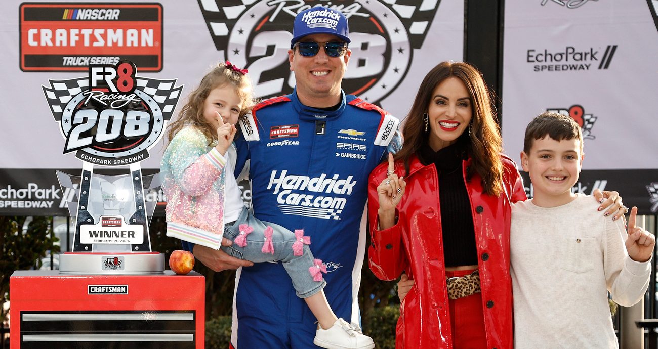 Kyle Busch, driver of the No. 7 HendrickCars.com Chevrolet, celebrates with daughter, Lennix Busch son, Brexton Busch and wife, Samantha Busch in victory lane after winning the NASCAR Craftsman Truck Series Fr8 Racing 208 at Echo Park Speedway on Feb. 21, 2026 in Hampton, Georgia.