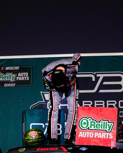 Ross Chastain does a bow in honor of Kyle Busch at Charlotte Motor Speedway.