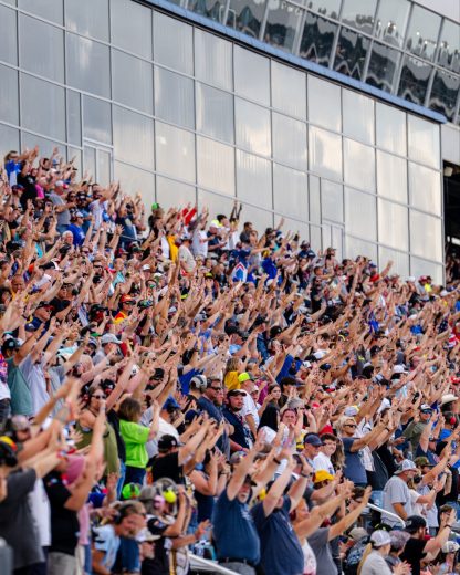 Fans hold up eight fingers in honor of Kyle Busch.