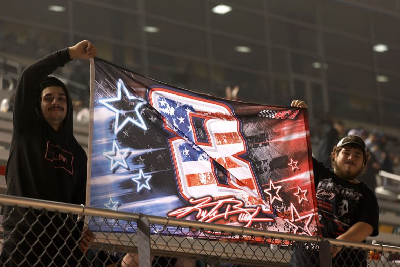 Fans hold up a Kyle Busch No. 8 flag.
