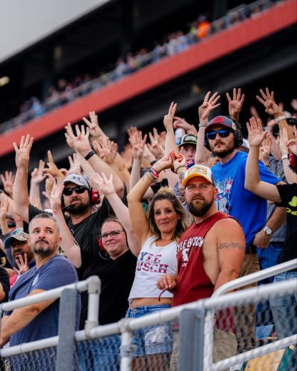 Fans hold up eight fingers in honor of Kyle Busch.