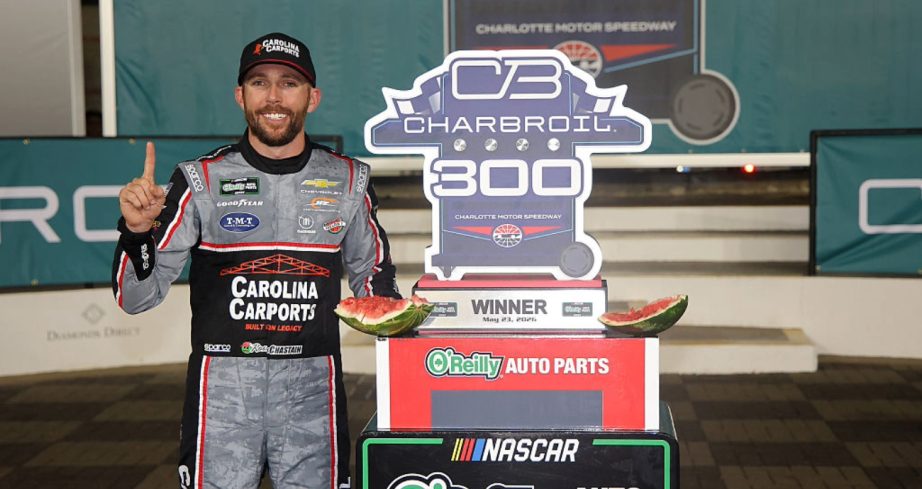 Ross Chastain celebrates in Victory Lane at Charlotte.