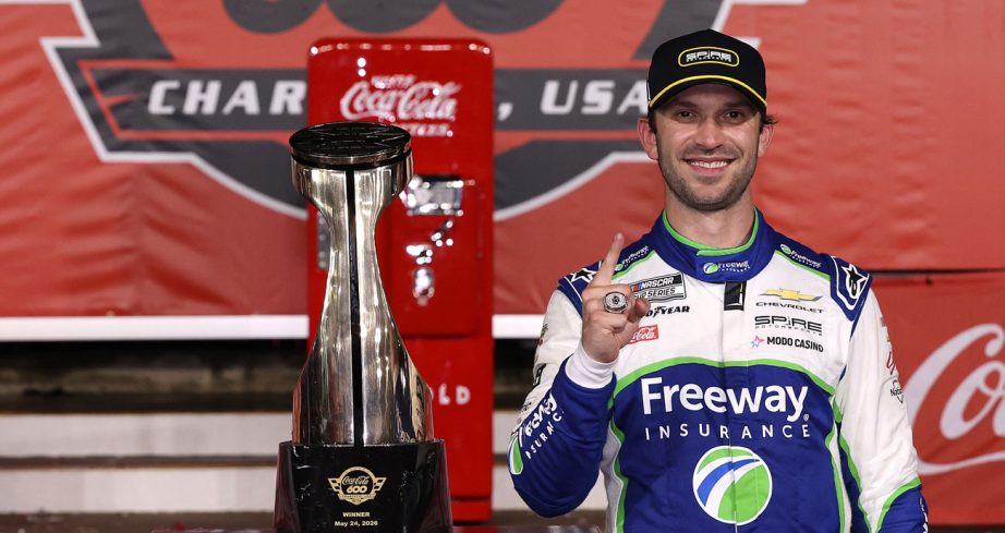 Daniel Suarez poses for a photo in Victory Lane at Charlotte Motor Speedway.