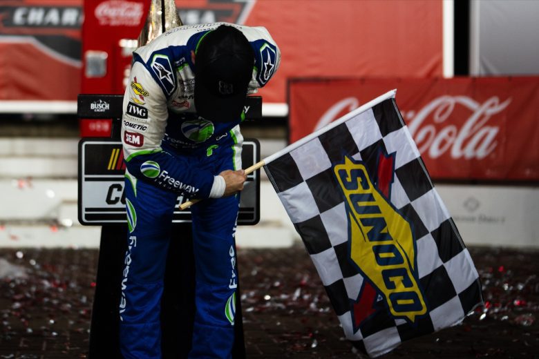 Daniel Suarez does a celebratory bow at Charlotte Motor Speedway.