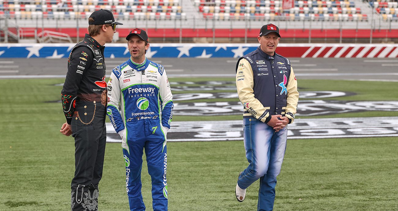 Carson Hocevar, driver of the #77 Chili's Ride the 'Dente Chevrolet, Daniel Suarez, driver of the #7 Freeway Insurance Chevrolet, and Michael McDowell, driver of the #71 Modo Casino Chevrolet, on the grid during practice for the NASCAR Cup Series Coca-Cola 600 at Charlotte Motor Speedway on May 23, 2026 in Concord, North Carolina. 