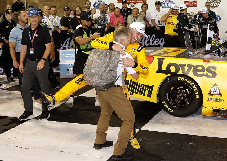 Scott Riggs hugs Layne Riggs.