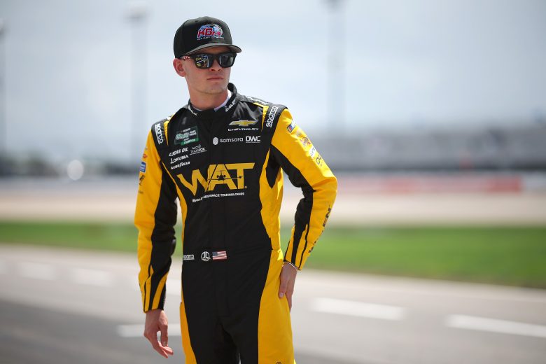 Jesse Love walks the grid at Nashville Superspeedway before O'Reilly Series practice