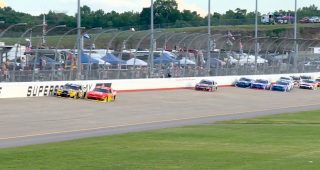 Allgaier takes lead amid three-wide fight