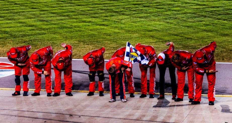 The entire No. 7 JRM stands in a row do a bow.