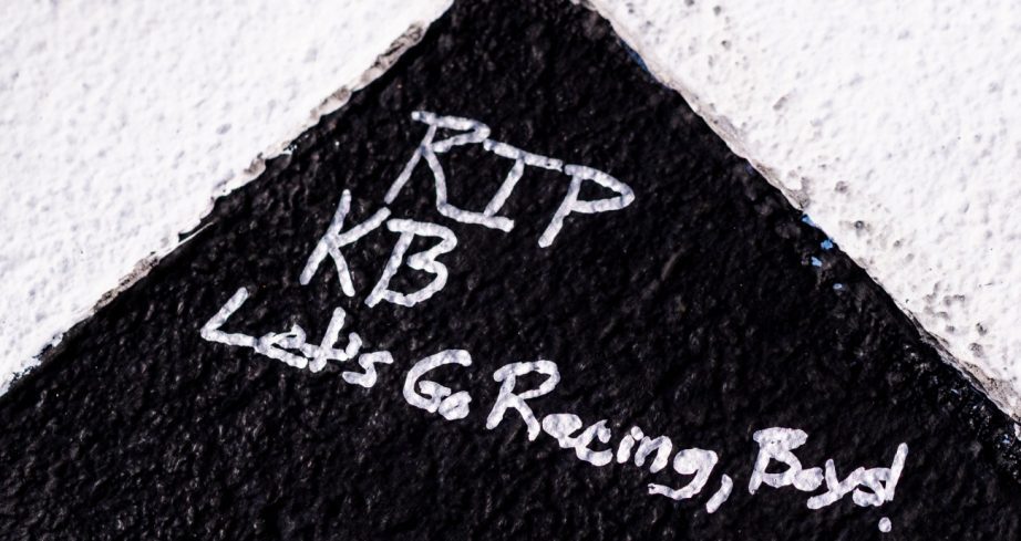 View of RIP KB as a hand written message on the start finish line.
