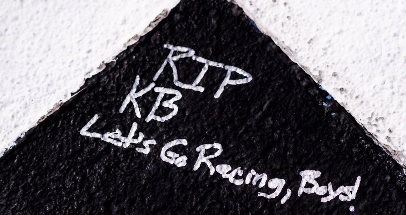 View of RIP KB as a hand written message on the start finish line.