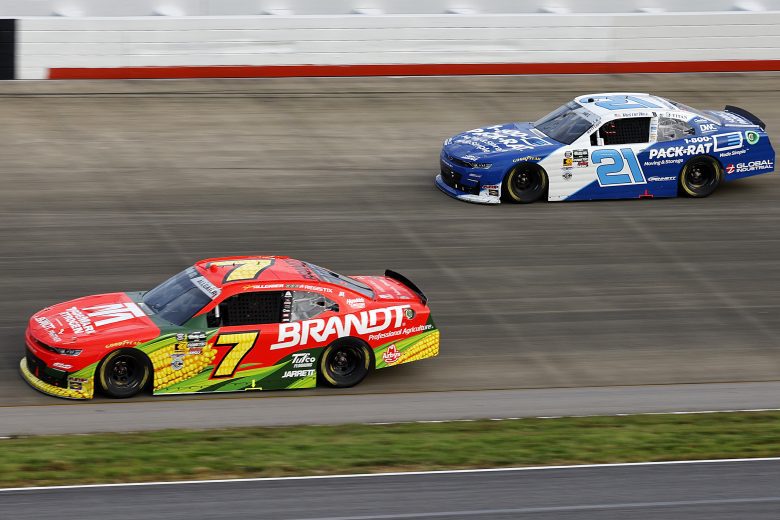 Justin Allgaier passes Austin Hill for track position during the Saturday race.