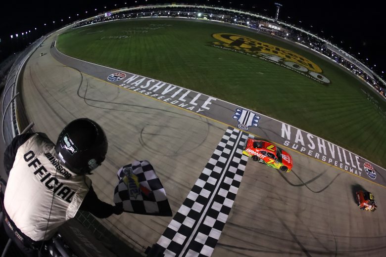 Justin Allgaier crosses the finish line first to win the O'Reilly Auto Parts Series race at Nashville.