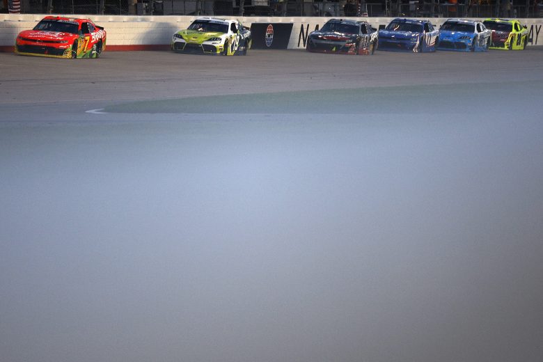 Justin Allgaier moves back into the lead ahead of Brent Crews at Nashville.