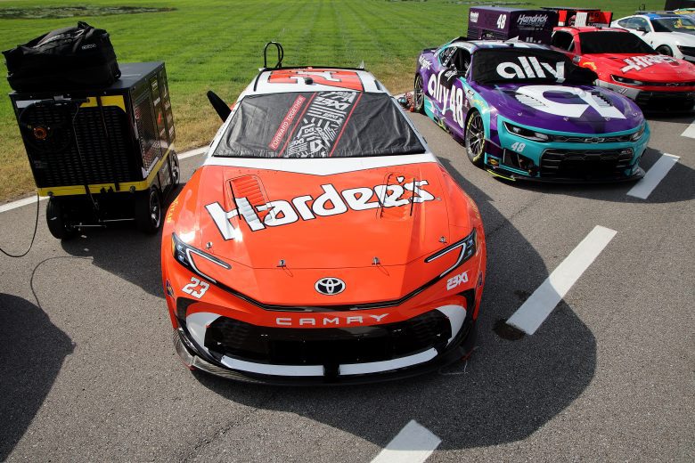 Throwback style of the No. 23 Hardees Toyota on pit road.