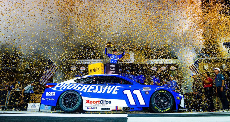 A view of the No. 11 Joe Gibbs Racing Toyota with Denny Hamlin celebrating as confetti flies at Nashville Superspeedway.