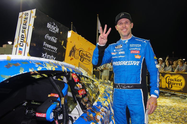 Denny Hamlin poses for a photo in Victory Lane at Nashville Superspeedway.