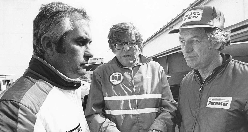 A 1976 meeting of team-owner giants (from left) Roger Penske, Bud Moore and Glen Wood in the NASCAR garage.