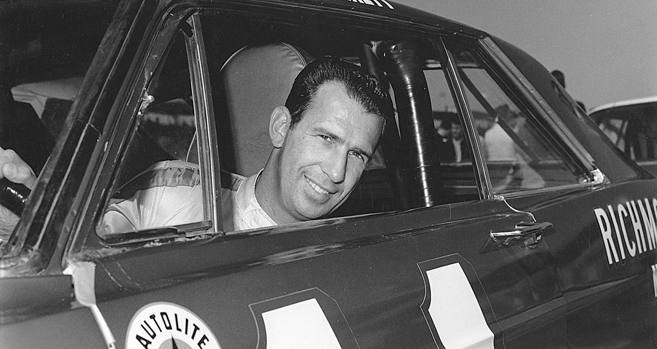 Ned Jarrett looks on.