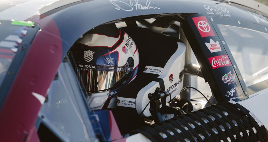 Denny Hamlin sits in his car for qualifying at Michigan.