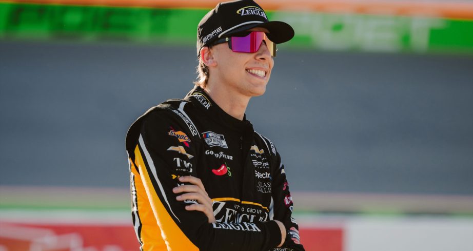 Carson Hocevar watches NASCAR qualifying at Michigan.