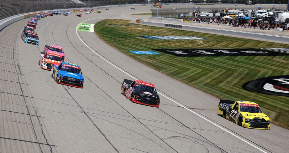 NASCAR Craftsman Truck Series trucks race at Michigan International Speedway.