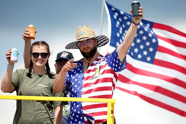 Fans pose for a photo at Michigan International Speedway.