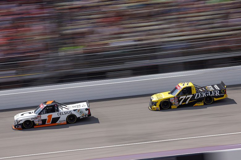 Corey Heim (No. 1) races ahead of Carson Hocevar (No. 77) at Michigan International Speedway.