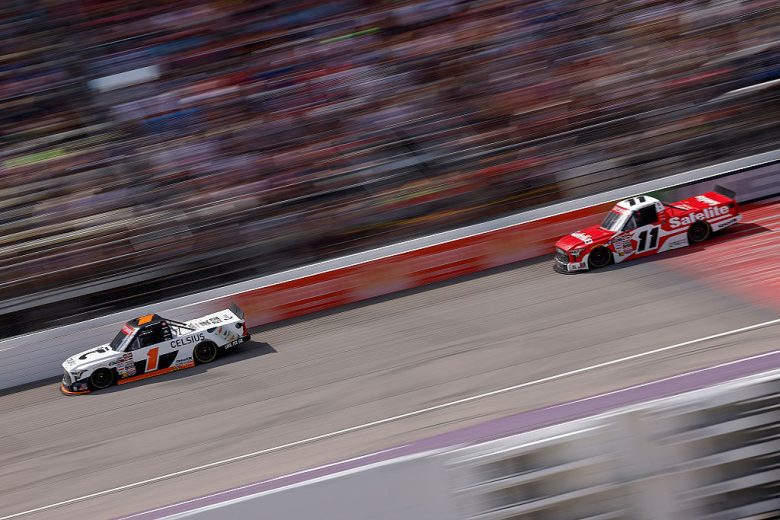 Corey Heim (No. 1) races ahead of Kaden Honeycutt (No. 11) at Michigan International Speedway.