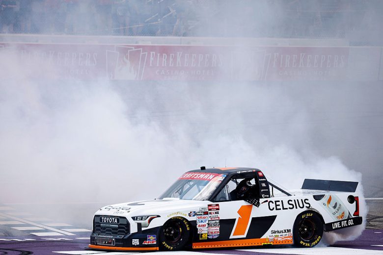 Corey Heim does a celebratory burnout in his No. 1 Toyota following his NASCAR Craftsman Truck Series win at Michigan International Speedway.