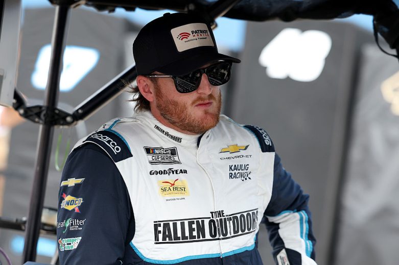 Ty Dillon looks on.