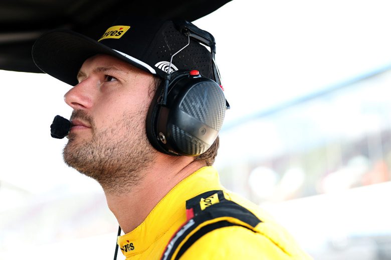 Todd Gilliland looks on.
